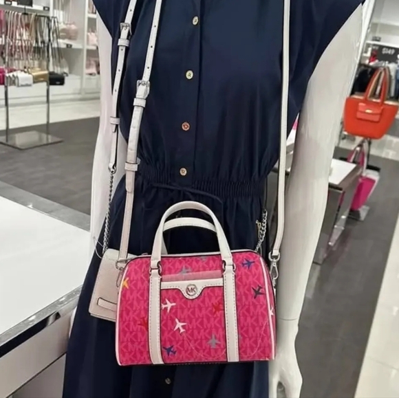 Michael Kors Small Airplane Logo Pink Duffle Crossbody - Picture 8 of 9